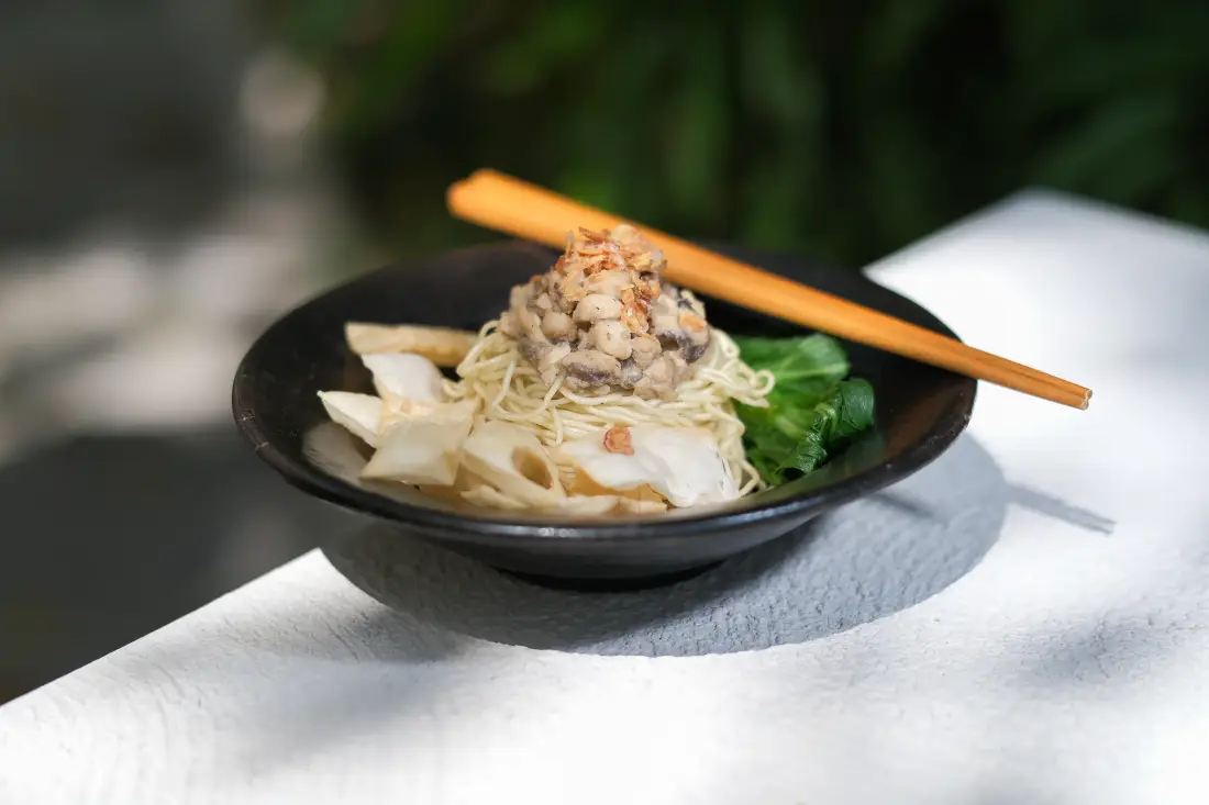 A bowl of Mee Mertua, the grandmother recipe, with chopsticks resting on it
